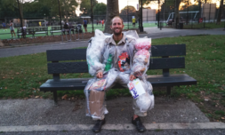Activist wears a month’s worth of trash as a suit