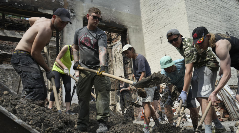 Young volunteers are rebuilding Ukrainian towns with clean-up raves