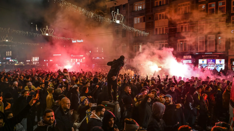 What sparked the violent clashes in Amsterdam?