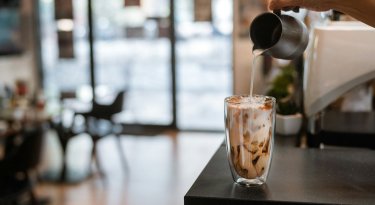 Is it acceptable to bring an iced coffee into a job interview?