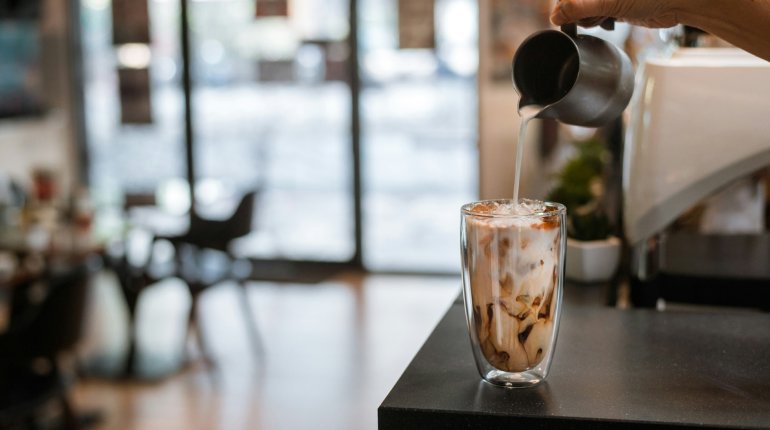 Is it acceptable to bring an iced coffee into a job interview?